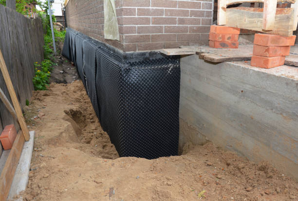 Happy homeowners after waterproofing job in Absecon